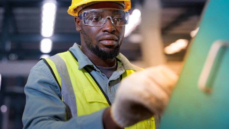 Factory Worker working in industry generator Power plant.
