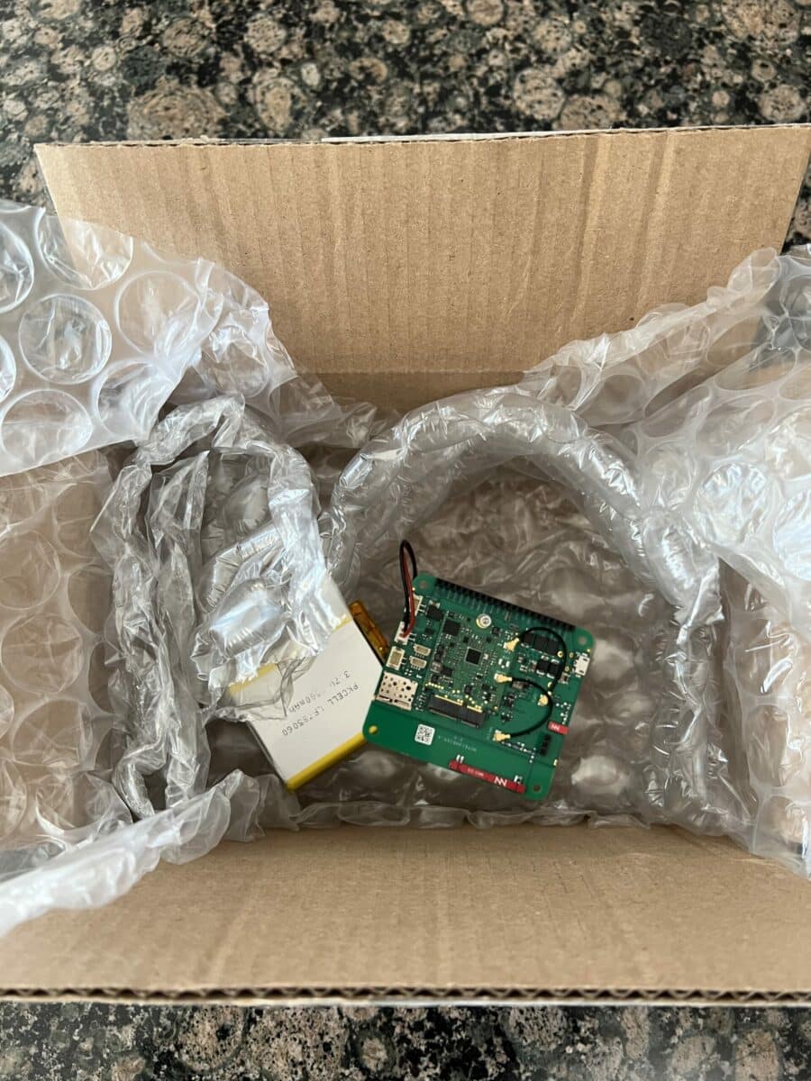 The asset tracker Notecard safely packed in a shipping box full of bubble wrap.